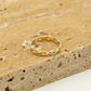 ring gevlochten goudkleurig
