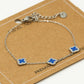Armband klavers blauw zilverkleurig