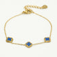 Armband klavers blauw goudkleurig