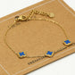 Armband klavers blauw goudkleurig
