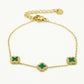Armband klavers groen goudkleurig