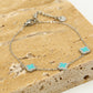Armband klavers turquoise zilverkleurig