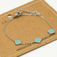 Armband klavers turquoise zilverkleurig