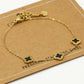 Armband klavers zwart goudkleurig