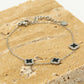 Armband klavers zwart zilverkleurig