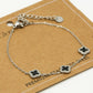 Armband klavers zwart zilverkleurig