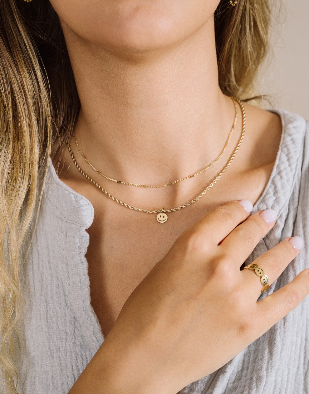Ketting smiley gedraaid goudkleurig