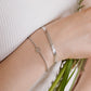 Gedraaide armband smiley zilverkleurig