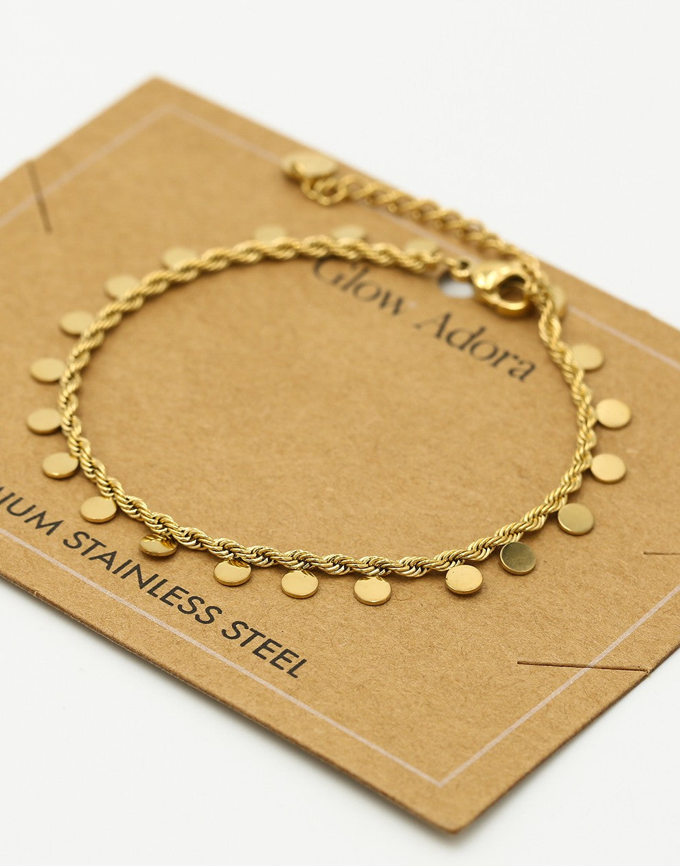 Gedraaide armband muntjes goudkleurig