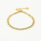 Gedraaide armband bolletjes goudkleurig