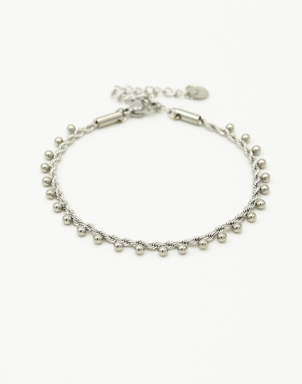 Gedraairde armband bolletjes zilverkleurig