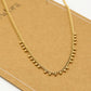 Schakelketting bolletjes goudkleurig