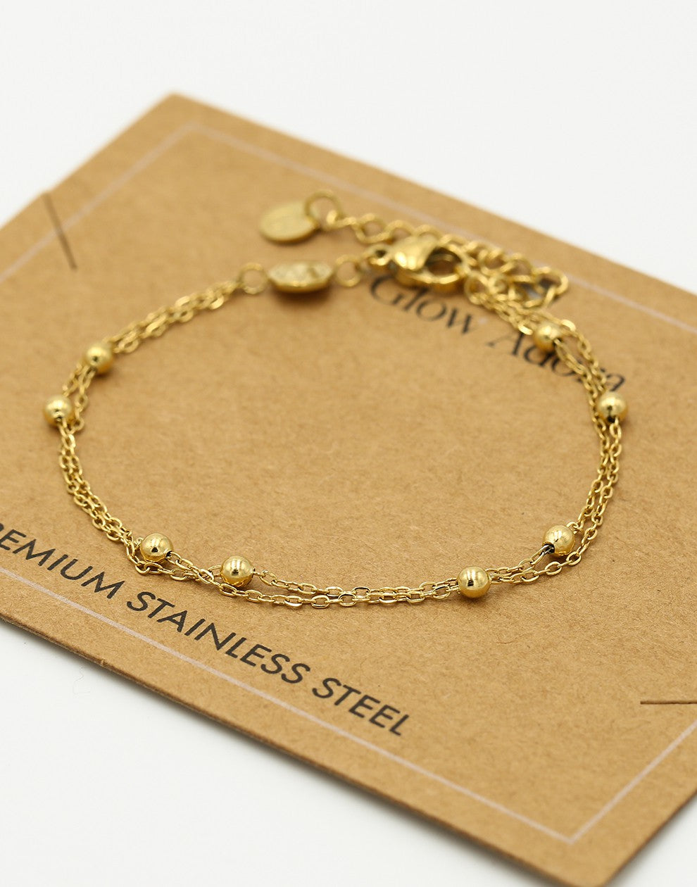 Armband dubbel bolletjes goudkleurig