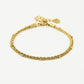 Armband dubbel gedraaid bolletjes goudkleurig