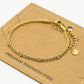 Armband dubbel gedraaid bolletjes goudkleurig