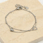 Dubbel armbandje met hartjes zilverkleurig