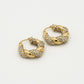 Twisted hoop earrings with rhinestones in gold color