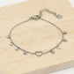 Fijne armband open hartje met vallende hartjes zilverkleurig
