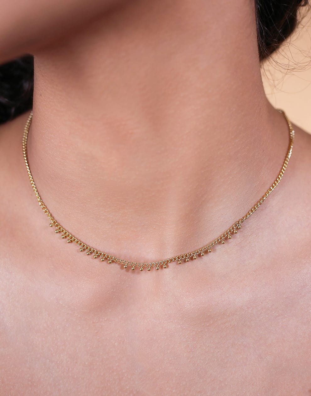 Schakelketting bolletjes goudkleurig