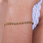 Gedraaide armband bolletjes goudkleurig