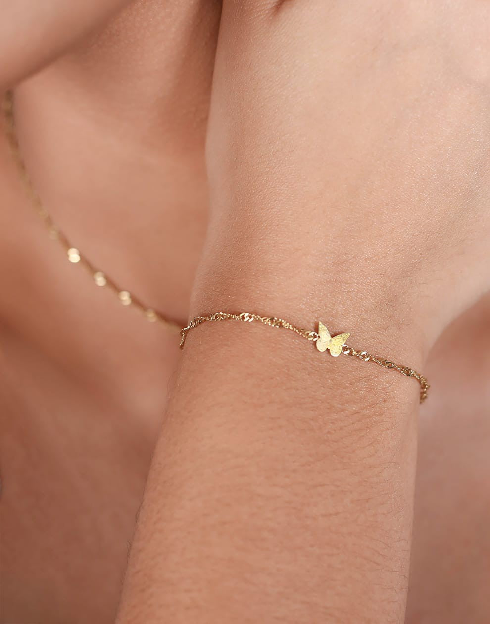 Armband vlinder goudkleurig