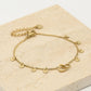 Armband dubbele hartjes met muntjes in goudkleurig