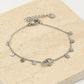 Armband dubbele hartjes met muntjes in zilverkleurig