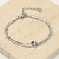 Dubbelle armband snake chain en hartjes zilverkleurig