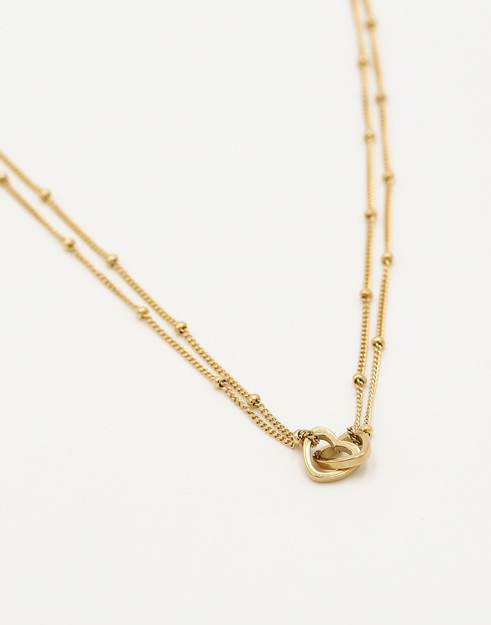 ketting bolletjes met dubbele hartjes goudkleurig