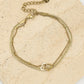 Dubbelle armband snake chain en hartjes goudkleurig