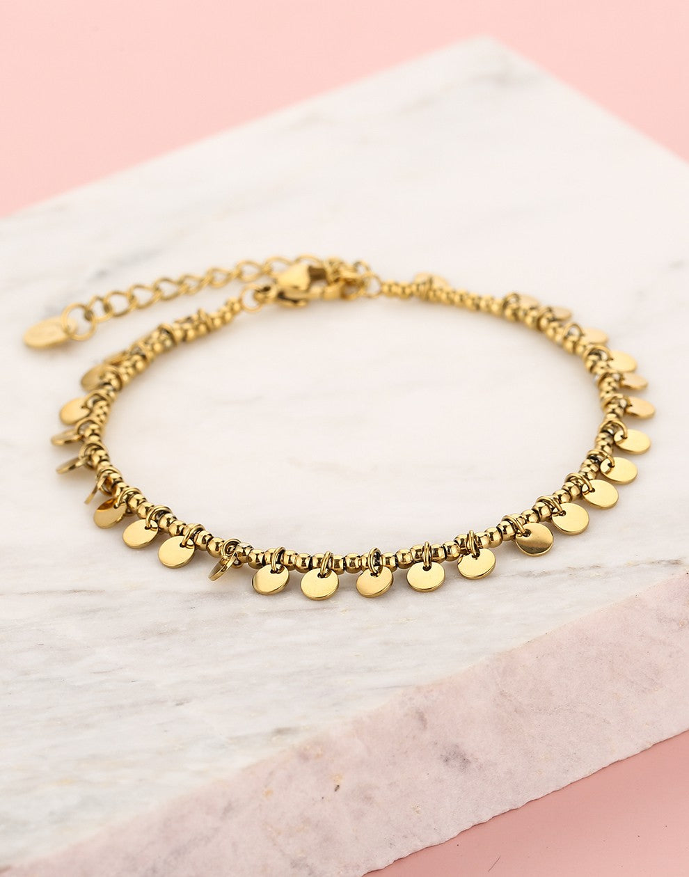 Armband bolletjes muntjes goudkleurig
