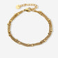 Bracelet with double gold-colored beads