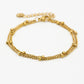 Bracelet with double gold-colored beads