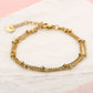 Bracelet with double gold-colored beads