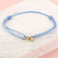 armband dubbele hartjes blauw goudkleurig