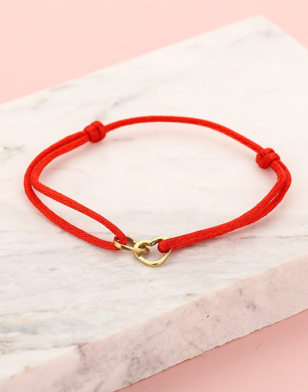 armband dubbele hartjes rood goudkleurig