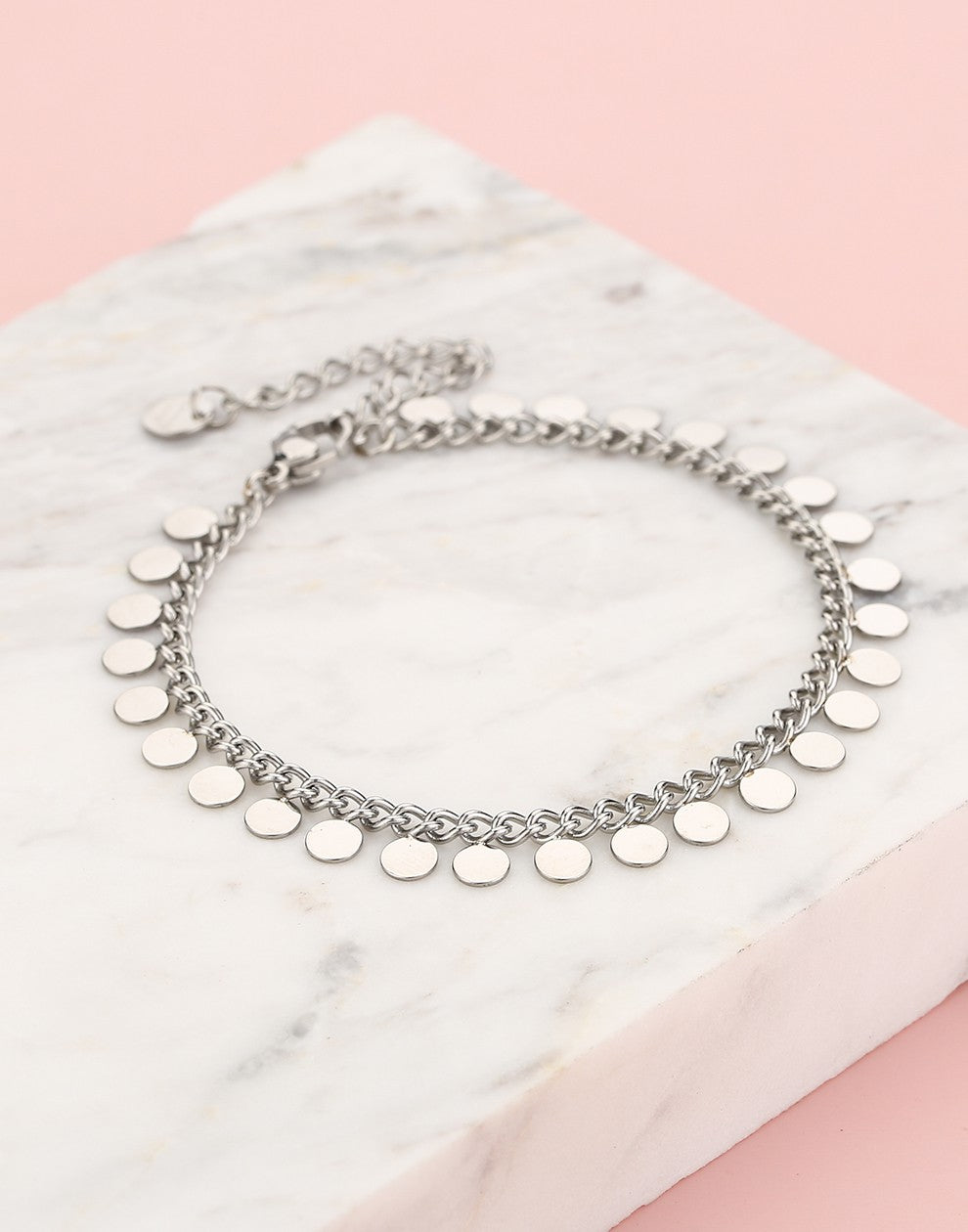 silver-colored coin link bracelet