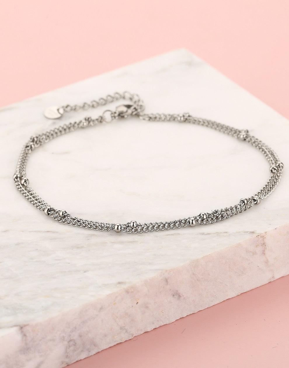 Ankle bracelet with double silver-colored beads