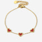 armband drie hartjes rood goudkleurig