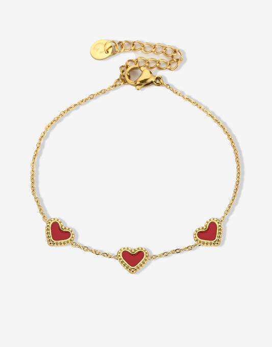 armband drie hartjes rood goudkleurig