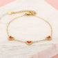 armband drie hartjes rood goudkleurig
