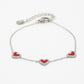 armband drie hartjes rood zilverkleurig