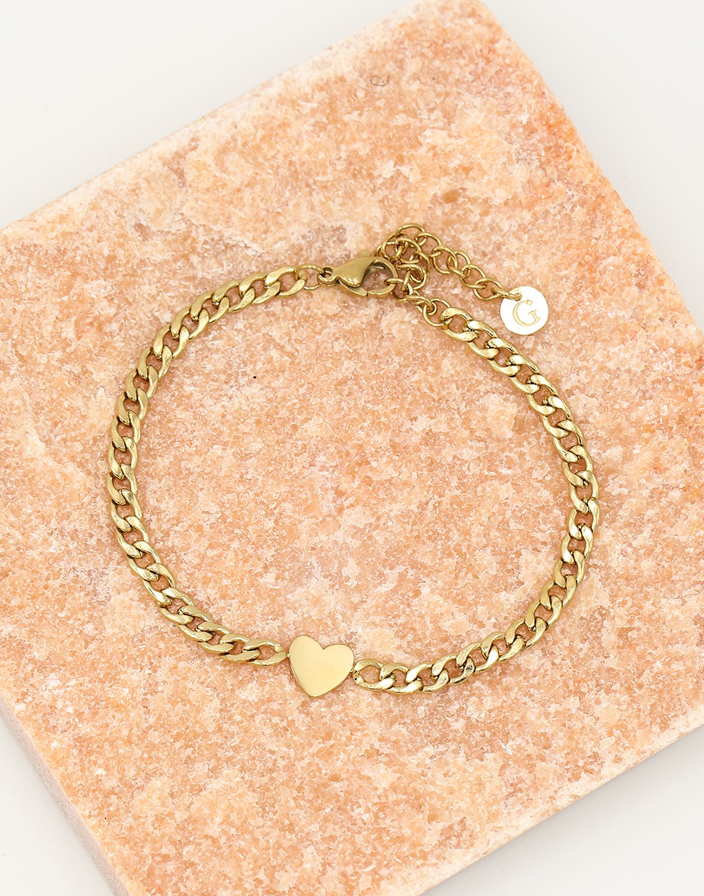 Schakelarmband met plat hartje goudkleurig
