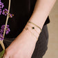 armband 3 open klavers goudkleurig