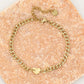Schakelarmband hartje met motief in goudkleurig