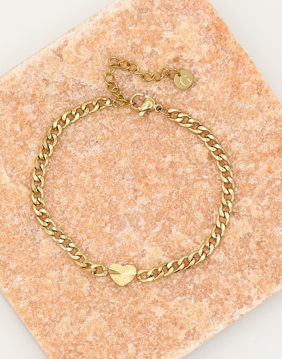 Schakelarmband hartje met motief in goudkleurig
