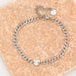 Schakelarmband hartje met motief in zilverkleurig