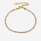 Gedraaide schakelarmband goudkleurig