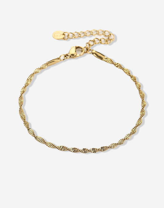 Gedraaide schakelarmband goudkleurig