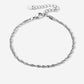Gedraaide schakelarmband zilverkleurig
